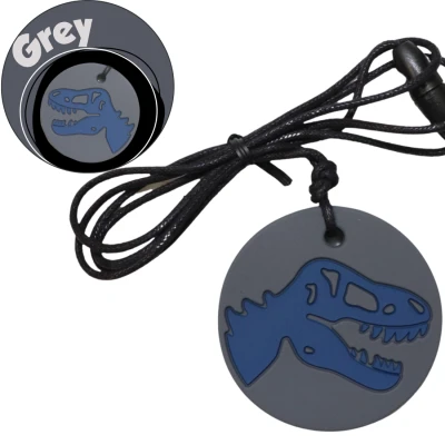 JELLYSTONE DESIGNS Jellystone Gryzak terapeutyczny antystresowy naszyjnik – dinozaur szary | Pan Piksel