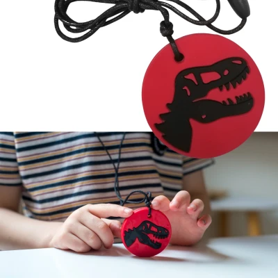 JELLYSTONE DESIGNS Jellystone Gryzak terapeutyczny antystresowy naszyjnik – dinozaur czerwony | Pan Piksel