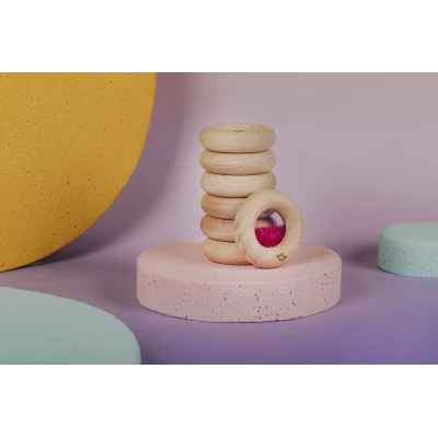 Petit Boum Drewniana zabawka sensoryczna do rączki Donut Calm Różowy 6m+